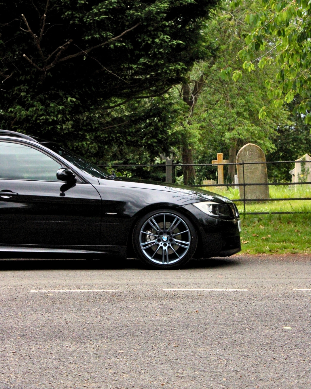 A side angle shot taken by Flight and Flora of a Black BMW's front right wheel